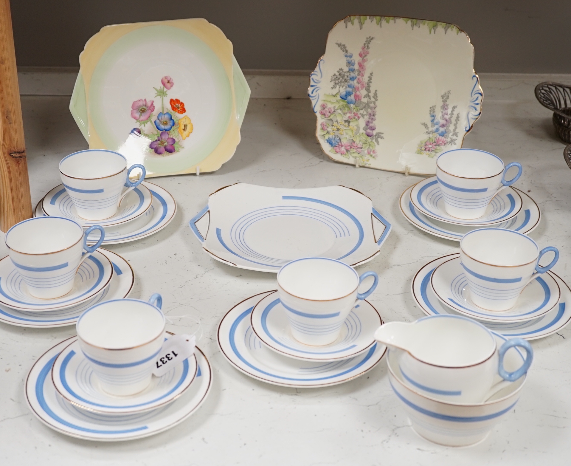 A Shelley Art Deco tea set numbered 795072 and sandwich plate together with a similar Foley plate, the largest 24.5cm wide